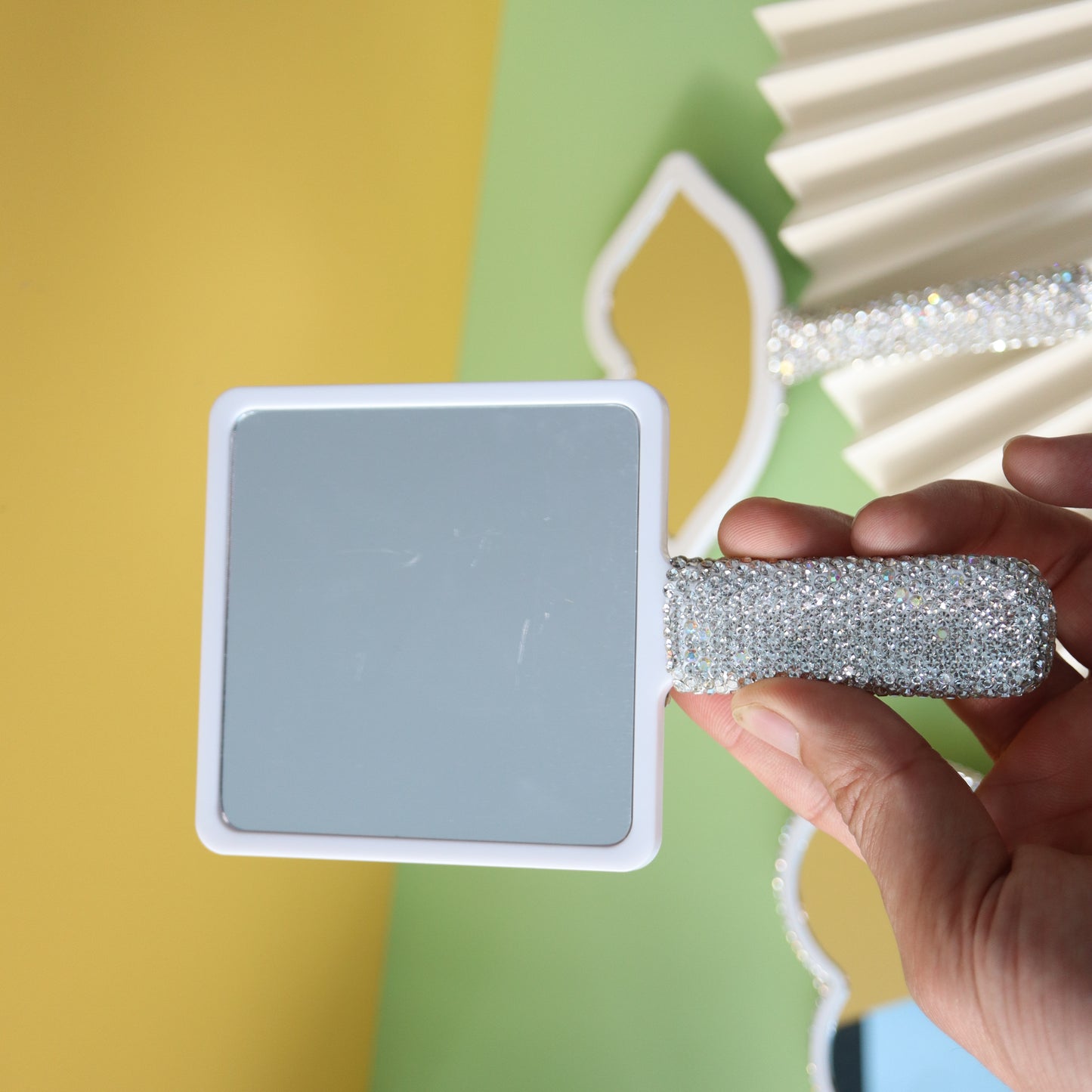Handheld makeup mirror with diamond eyelash extension