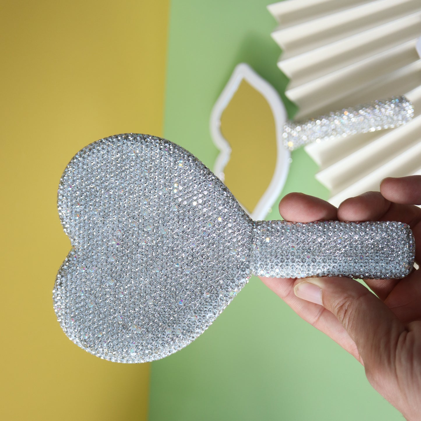 Handheld makeup mirror with diamond eyelash extension